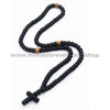 Black orthodox rosary necklace with wooden beads on a white background