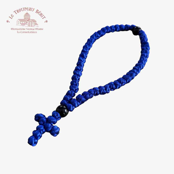 Blue orthodox prayer rope with a black bead on a white background with "Troupeau Benit" logo branding 