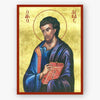 Icon of Evangelist Luke holding a book on a gold background
