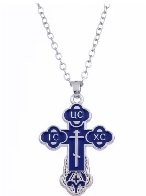 Blue and silver cross pendant on a white background