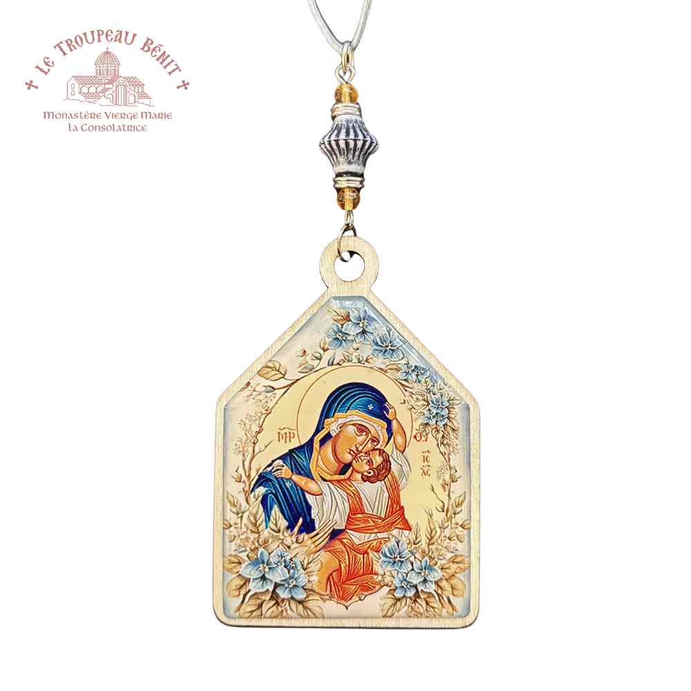 Decorative Orthodox icon pendant with religious design on a white background with 