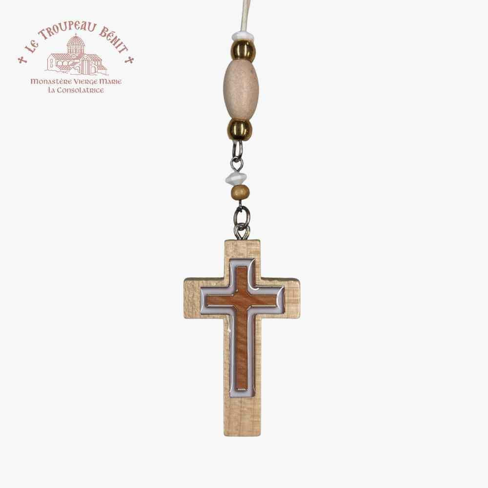 Wooden cross pendant with beads on a white background with 'Troupeau Benit' logo branding