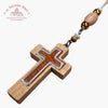 Wooden cross pendant with beaded chain on a white background with 'Troupeau Benit' logo branding