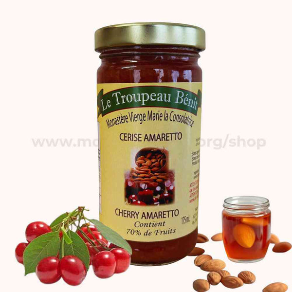 Jar of Le Troupeau Benit cherry amaretto jam with cherries and almonds on a white background