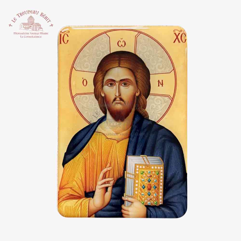 Icon of Christ holding the Gospel with decorative cover on a gold background with 'Troupeau Benit' logo branding in the top left corner