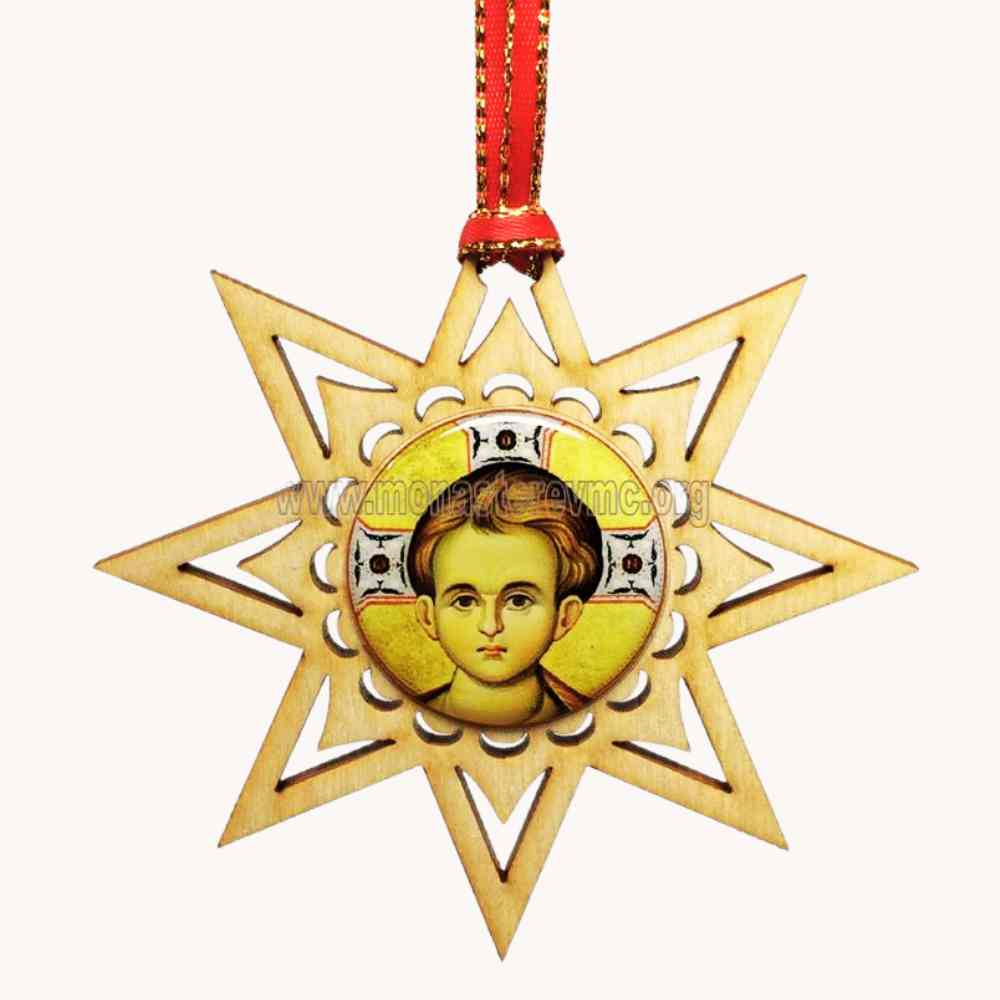 Decorative star-shaped pendant with Christ Emmanuel in the center on a white background