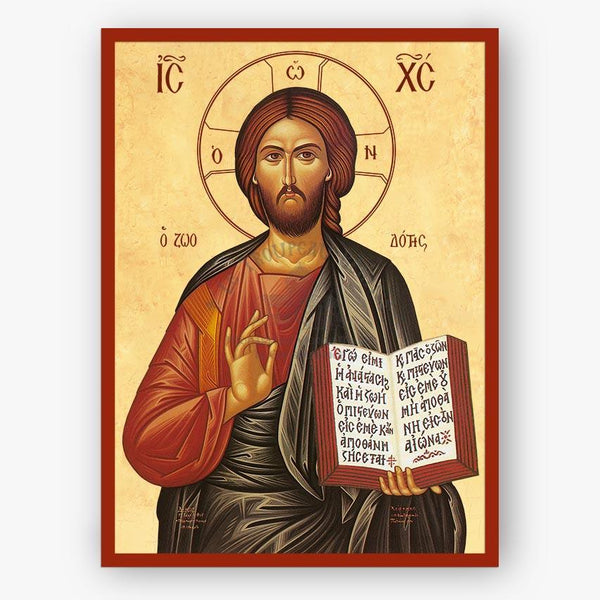 Icon of a religious figure holding a book with text, framed with decorative elements.