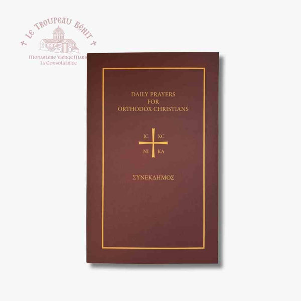 Brown book with gold text 'Daily Prayers for Orthodox Christians' and cross on a white background with 'Troupeau Benit' logo branding
