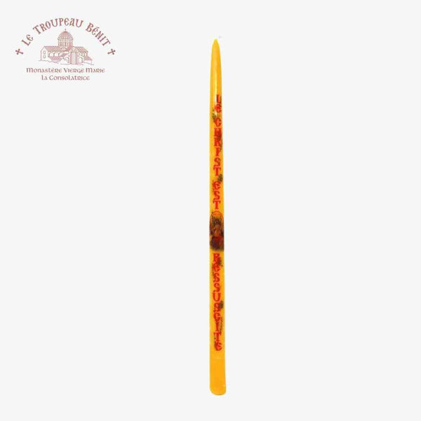 Yellow candle with French text 'Christ is risen' on a white background featuring 'Le Troupeau Benit' logo 