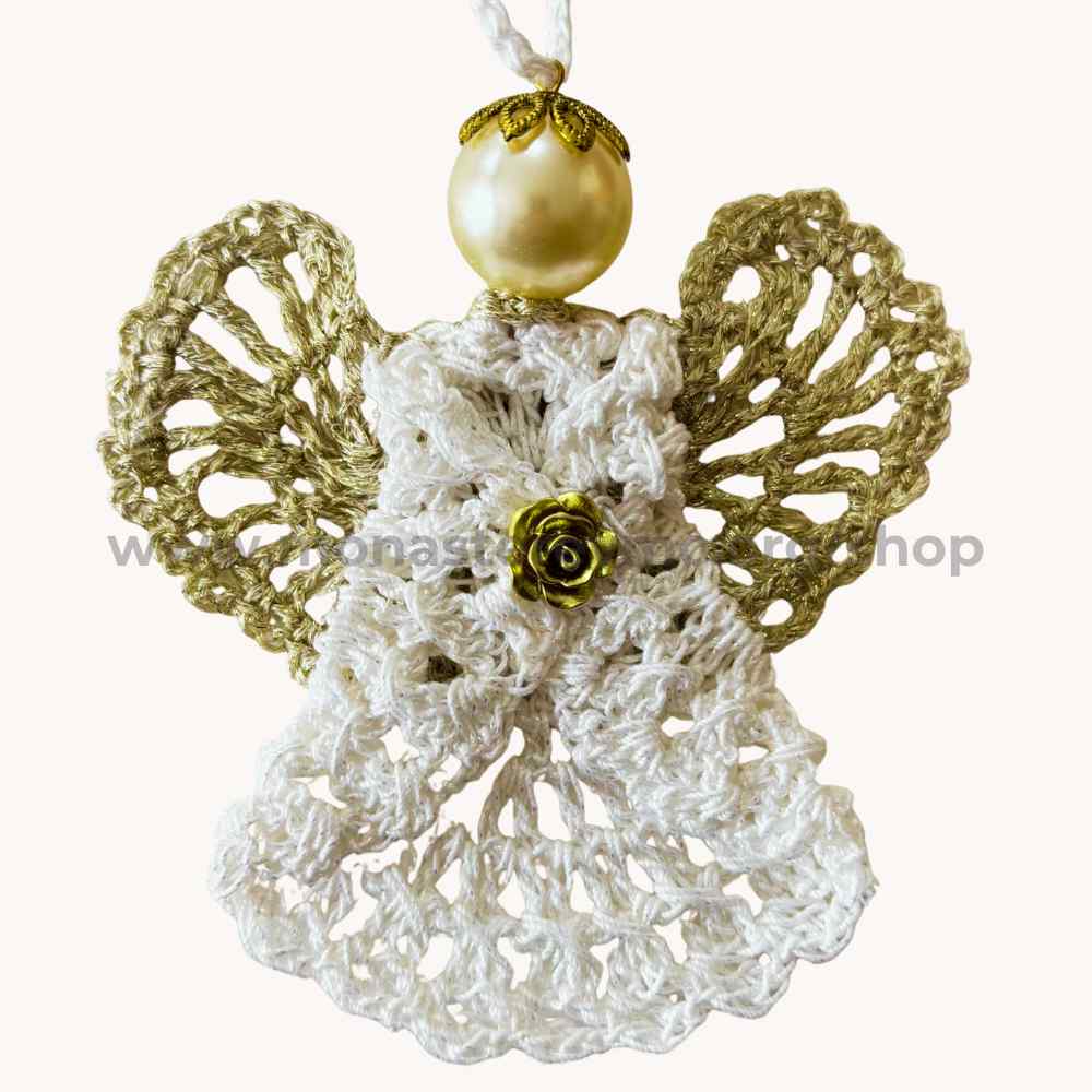 Decorative angel ornament with gold wings and pearl on a white background