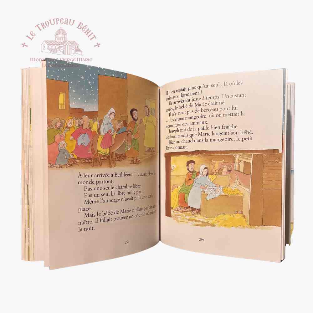 Open book with illustrated pages and text, featuring a religious scene.