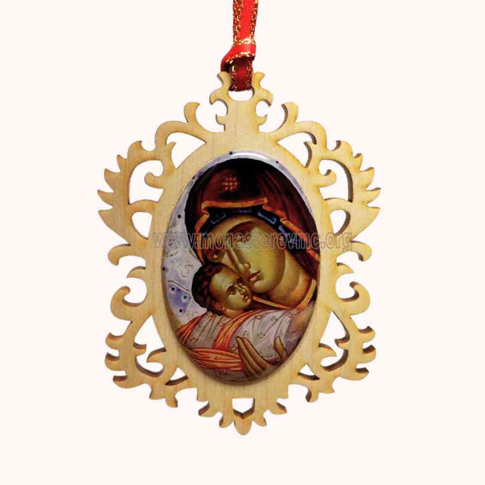 Decorative pendant with religious icon of the Virgin Mary holding Jesus, hanging from a red ribbon on a white background.