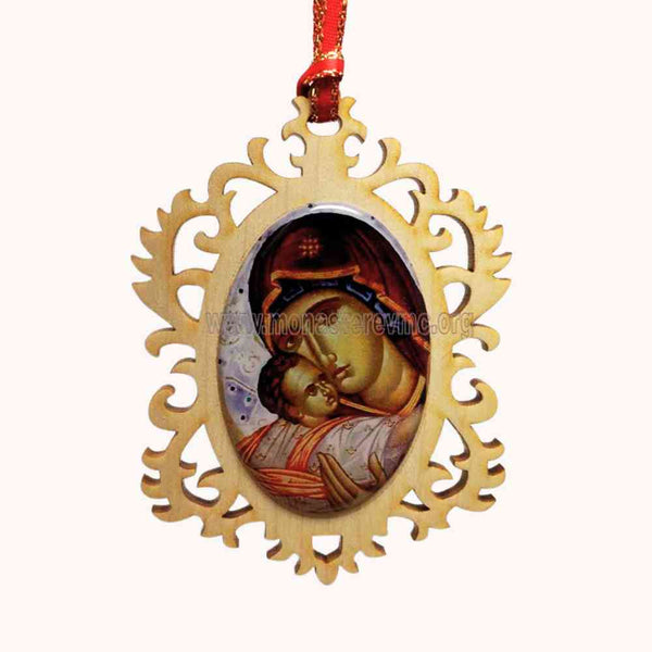 Decorative pendant with religious icon of the Virgin Mary holding Jesus, hanging from a red ribbon on a white background.