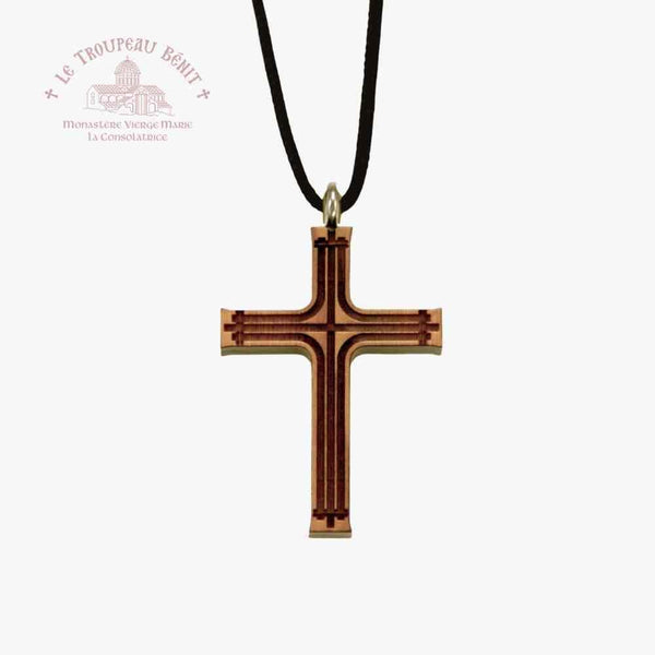 Wooden cross pendant on a black cord with a white background with 'Troupeau Benit' logo branding