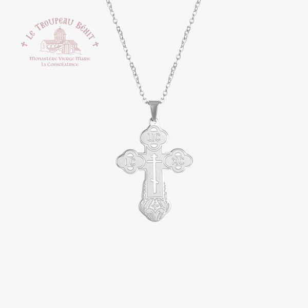 Silver cross pendant necklace on a white background with Troupeau Benit brand logo.