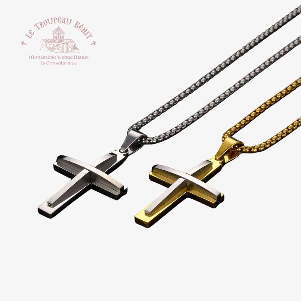 Two cross-shaped pendants on chains with 'Le Troupeau Benit' logo.