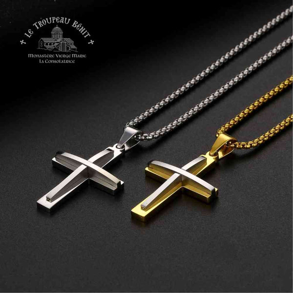 Two cross necklaces, one silver and one gold, on a dark background with 'Le Troupeau Bénit' branding.