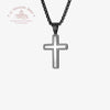 Black cross pendant necklace on a white background with Le Troupeau Benit logo.