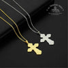 Two cross-shaped pendants on gold and silver chains against a black background with Troupeau Benit brand logo.