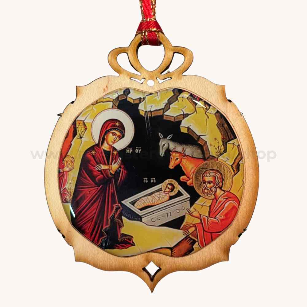 Decorative Christmas ornament with nativity scene design on a white background