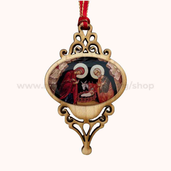 Decorative Christmas ornament with religious scene on a white background