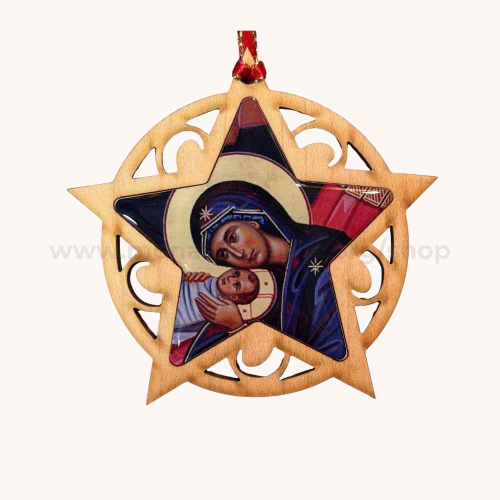 Decorative ornament with religious design featuring a star-shaped frame and a central icon of the Virgin Mary holding Christ.