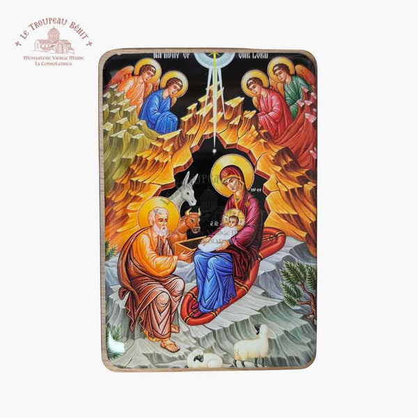 Decorative panel with religious scene of nativity, featuring colorful figures and animals on a white background with 'Troupeau Benit' logo branding