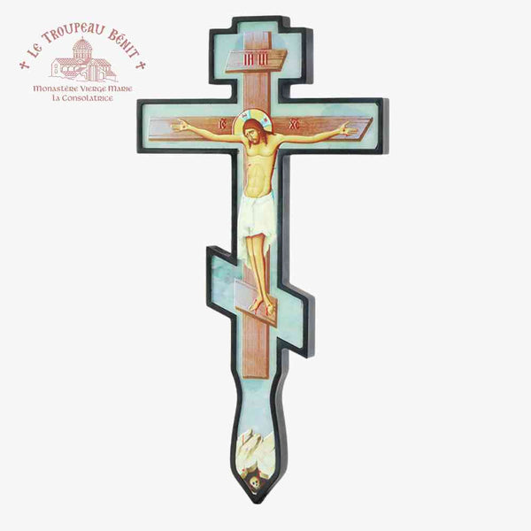Decorative cross with minimalist icon of Christ crucified on a light blue
 background 