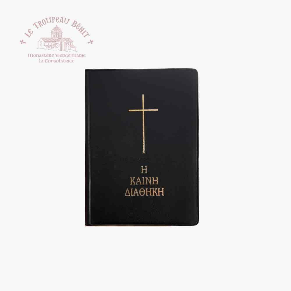 Black book with gold cross and text on a white background, with Troupeau Benit logo in the corner.