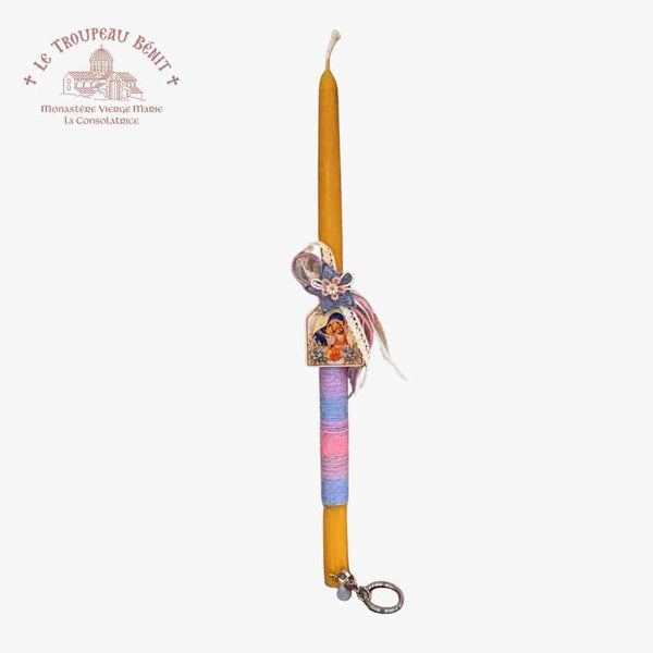Decorative candle with colorful holder and keychain attachment on a white background with "Troupeau Benit" logo branding