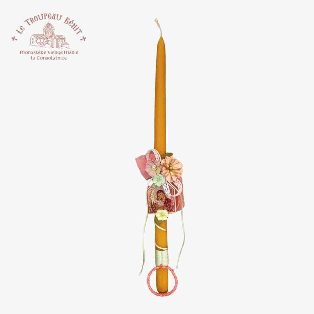 Decorative candle with floral holder on a white background, featuring the brand 'Le Troupeau Benit'.