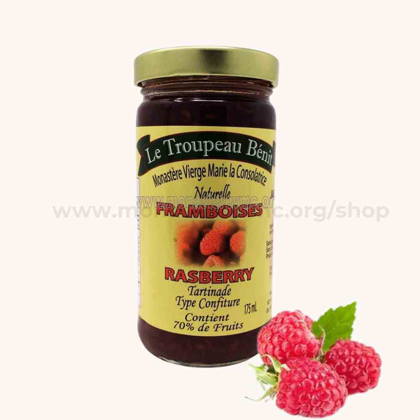 A jar of raspberry jam labeled 'Le Troupeau Benn', indicating that it is made with local fruits, honey and evaporated cane sugar.