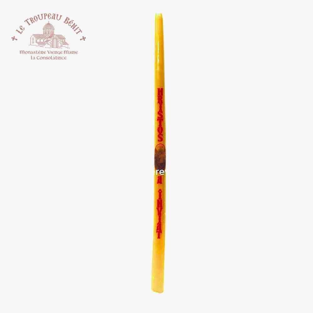 Yellow candle with red text in Romanian 'Christ is risen' on a white background, featuring Le Troupeau Benit logo.