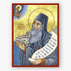 Icon of Saint Silouan the Athonite with a scroll and a landscape in the background on a gold background