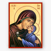 Saint Anna, holding the Theotokos who is holding a white flower on a beige background with a red border.
