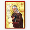 Icon of St. John Damascene holding a scroll with text and a staff, on a gold background.