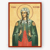 A religious icon print of Saint Fotini, depicted in a green cloak and red dress with a beige background and red border, shown against a light gray wall.