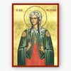 A religious icon print of Saint Fotini, depicted in a green cloak and red dress with a gold background and red border, shown against a light gray wall.