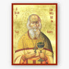 Saint Sophrony icon wearing a cross and holding a holy cup on a gold background. 