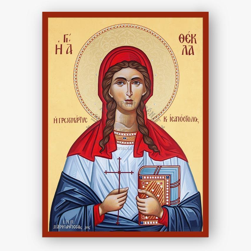 A Byzantine-style religious icon painting of Saint Thekla the Protomartyr on a cream background with a red border. The figure wears a red veil and blue-and-white garments, holds a red cross, and holds a book.