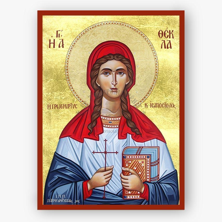A Byzantine-style religious icon painting of Saint Thekla the Protomartyr on a gold background with a red border. The figure wears a red head covering and blue robe with a white tunic, holds a red cross, and holds a book.