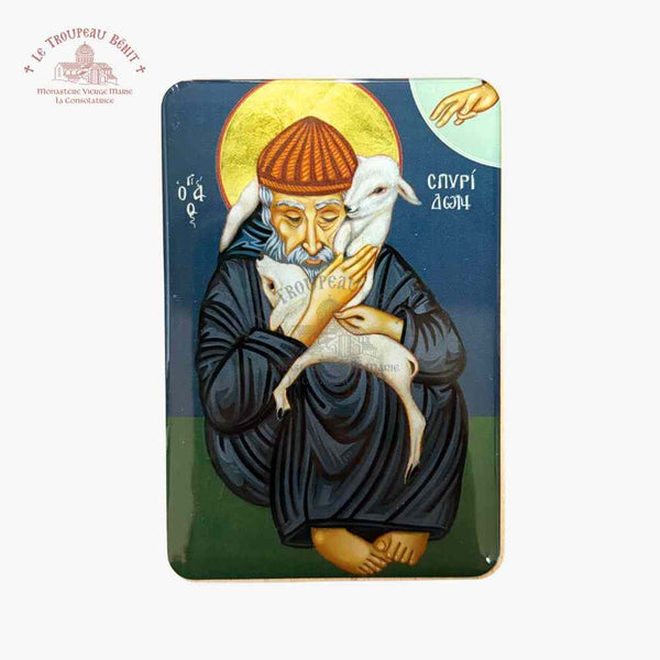 Icon of a religious figure holding a lamb with a blue background with 'Troupeau Benit' logo branding