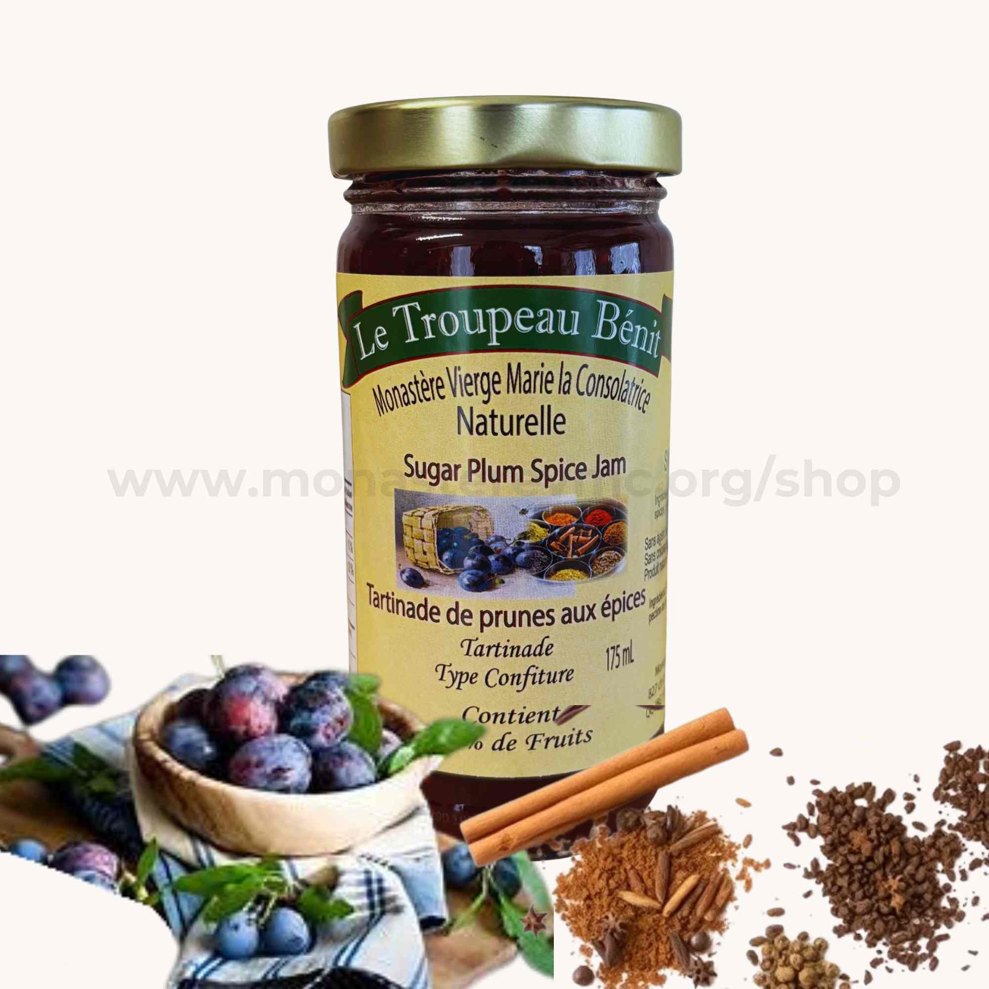 Jar of Le Troupeau Bénit Sugar Plum Spice Jam with ingredients on a white background