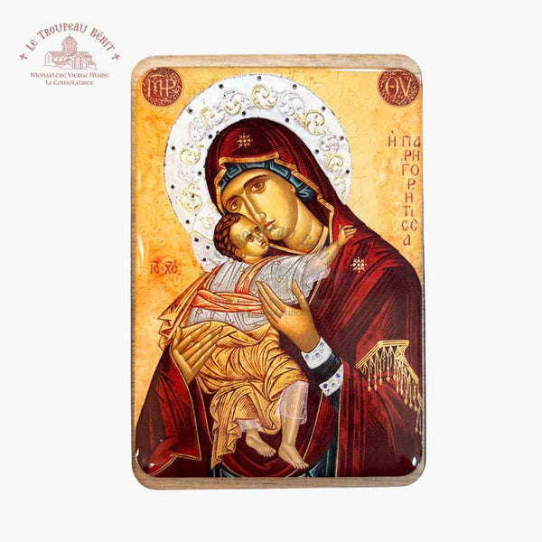 Icon of a religious figure holding a child on a beige background with 'Troupeau Benit' logo branding