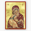 Decorative icon of the Theotokos, the saviour of souls, holding Christ with intricate details on a gold background