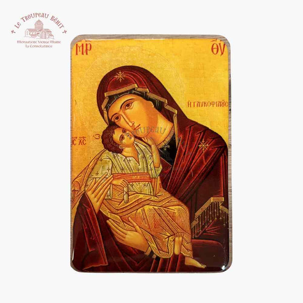 Icon of a religious figure holding a child on a gold background with visible 'Troupeau Benit' logo branding