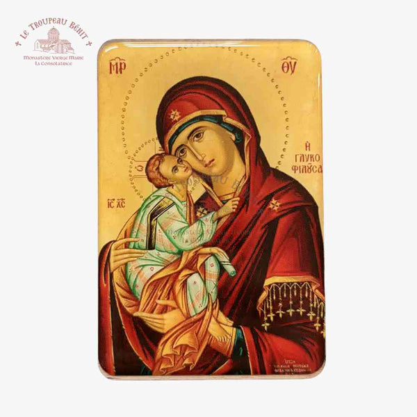 Icon of the Mother of God holding Christ on a gold background with visible 'Troupeau Benit' logo branding