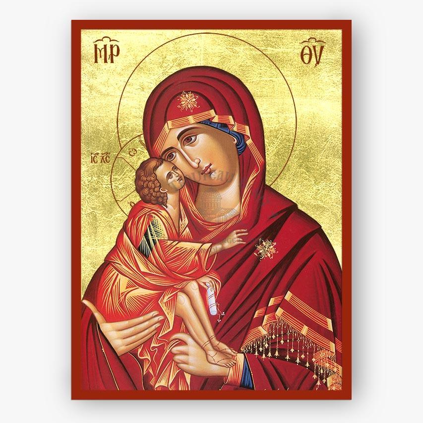 Icon of Mother of God holding Christ on a gold background