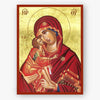 Icon of Mother of God holding Christ on a gold background