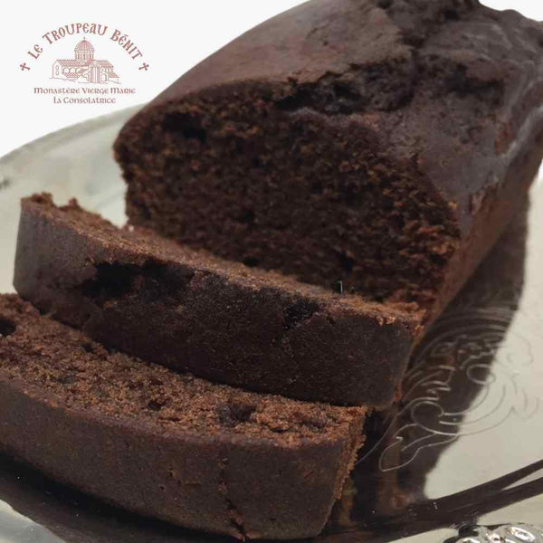 Chocolate loaf cake with slices on a decorative plate, featuring "Troupeau Benit" logo in the corner.